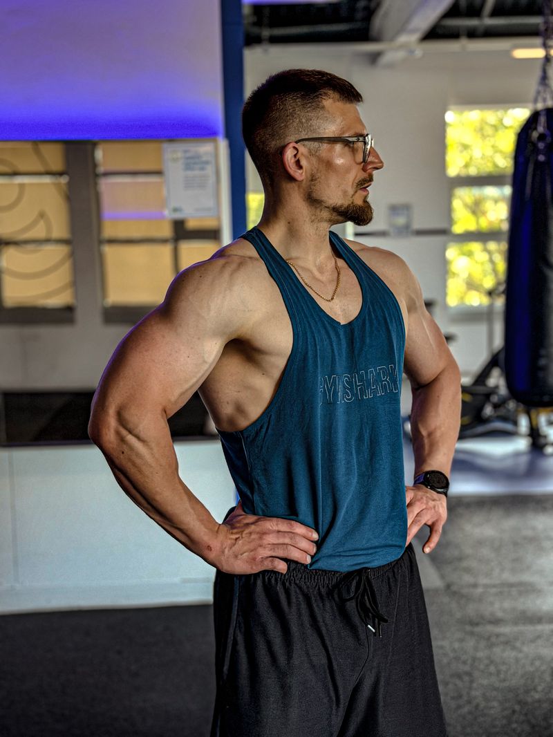 Personal trainer side profile in gym